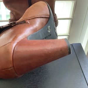 Soft leather boots , sits below knee